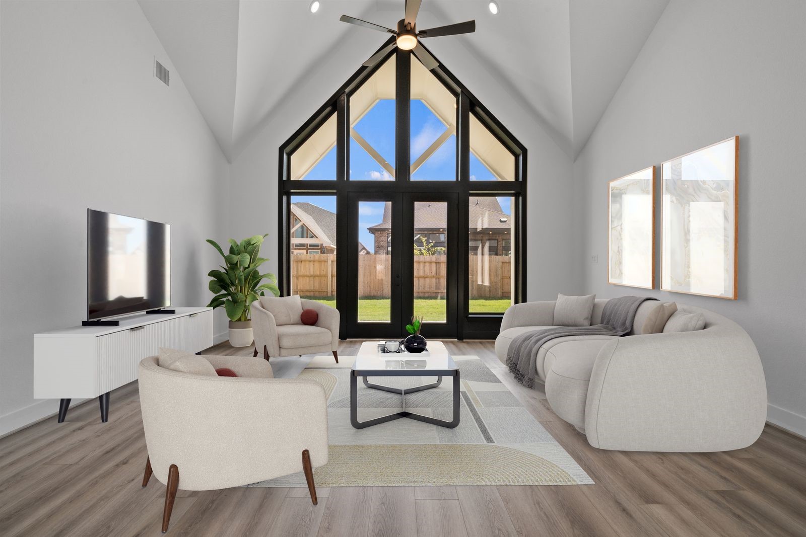 446 Silver Moon Way Katy, TX 77493 - Photo 7 of 34 The bold rear wall of windows adds the perfect touch of luxury.