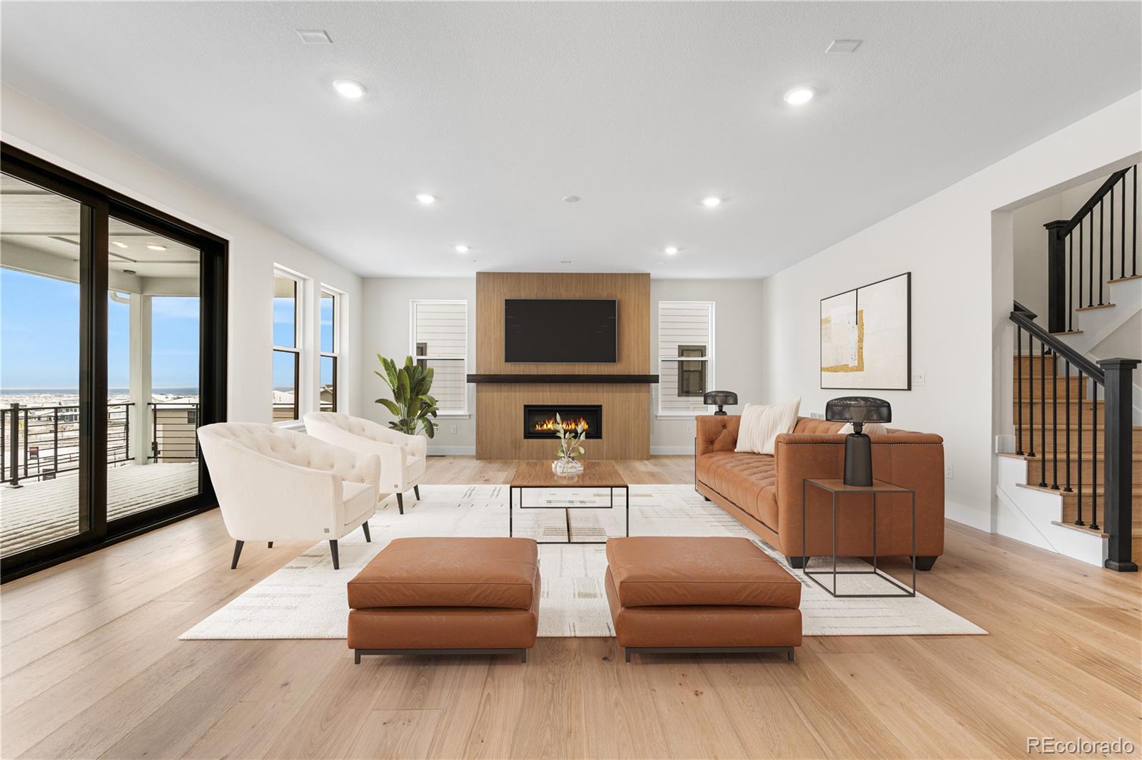 11303 Tenor Trail Lone Tree, CO 80134 - Photo 13 of 49 a living room with furniture a flat screen tv and wooden floor