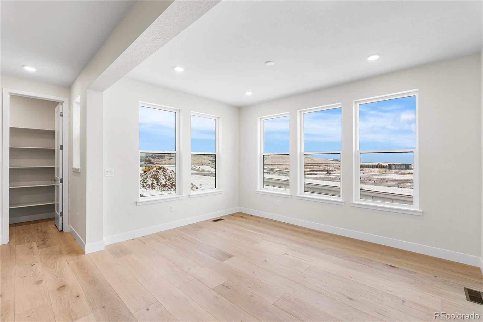 11303 Tenor Trail Lone Tree, CO 80134 - Photo 15 of 49 an empty room with windows