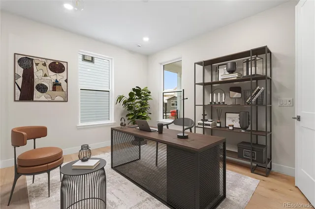 a room with a table chairs and a room