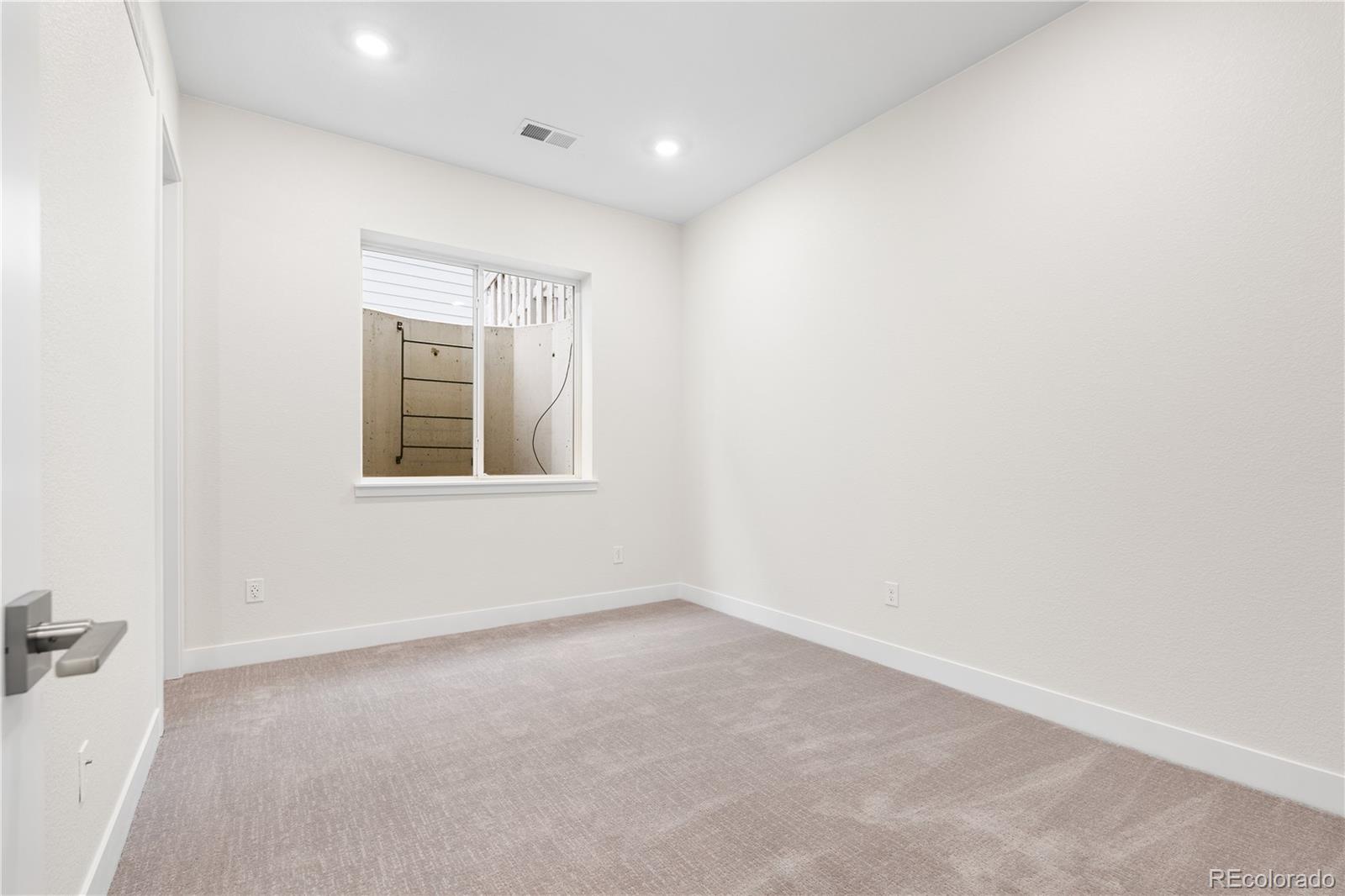 11303 Tenor Trail Lone Tree, CO 80134 - Photo 20 of 49 an empty room with windows