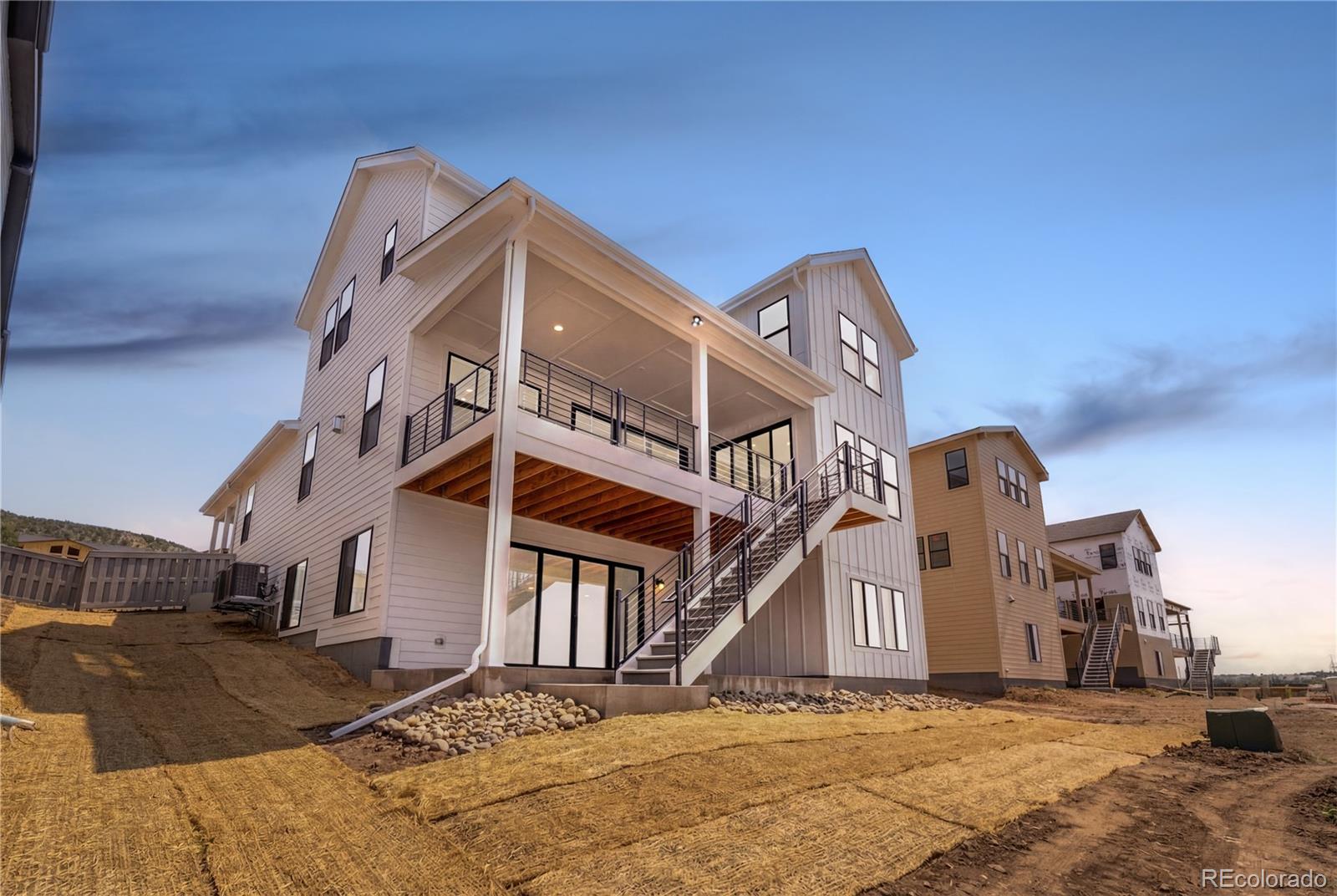 11303 Tenor Trail Lone Tree, CO 80134 - Photo 2 of 49 a view of a house with a snow in front of it
