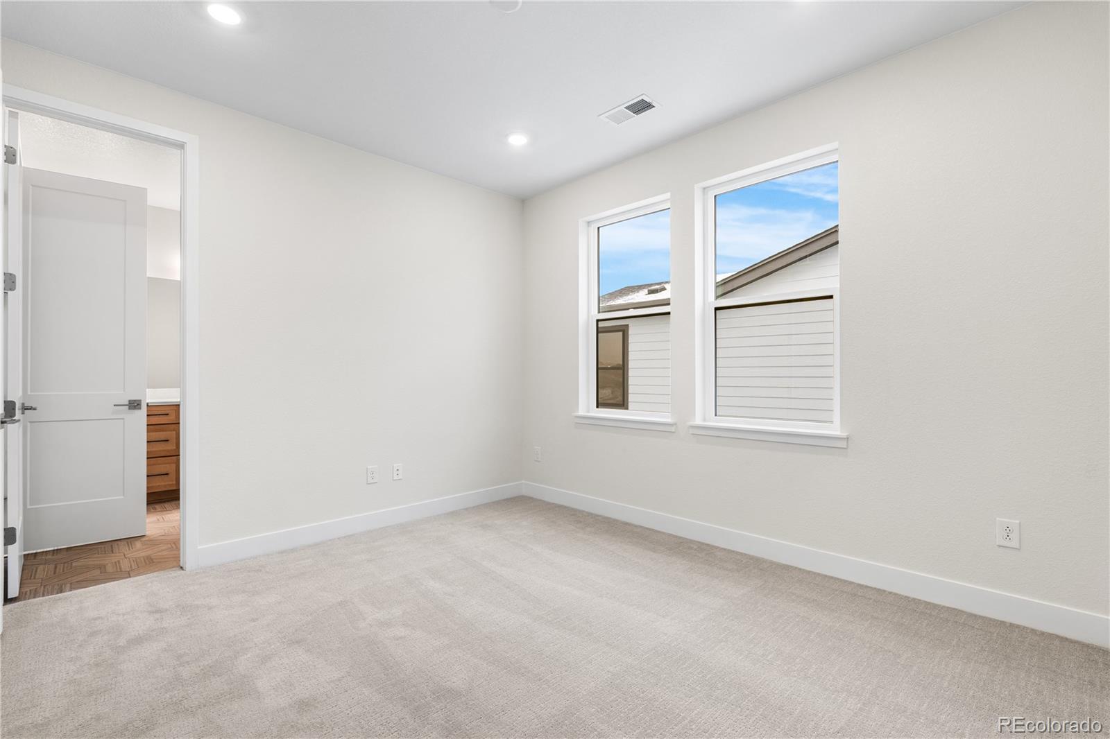11303 Tenor Trail Lone Tree, CO 80134 - Photo 21 of 49 an empty room with windows