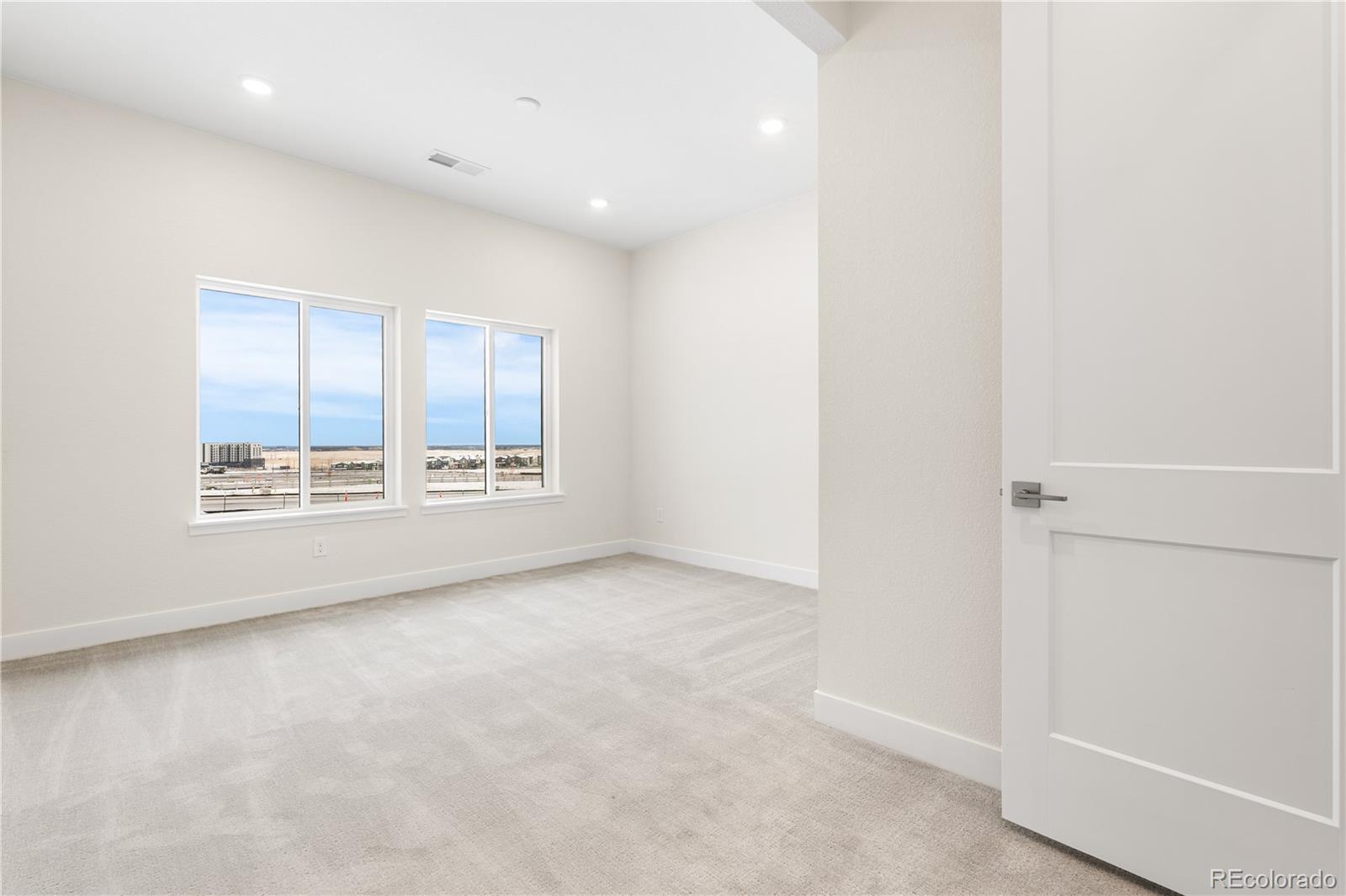 11303 Tenor Trail Lone Tree, CO 80134 - Photo 22 of 49 an empty room with windows