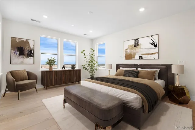 a bedroom with a large bed and furniture