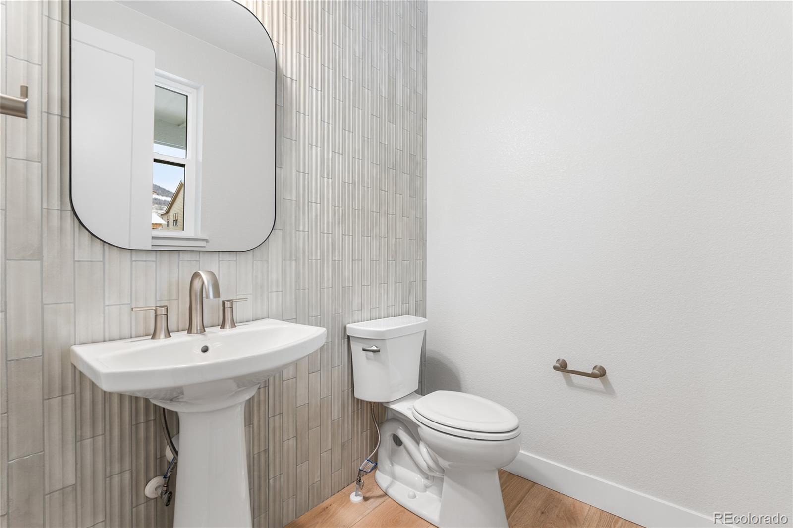 11303 Tenor Trail Lone Tree, CO 80134 - Photo 34 of 49 a bathroom with a sink and mirror