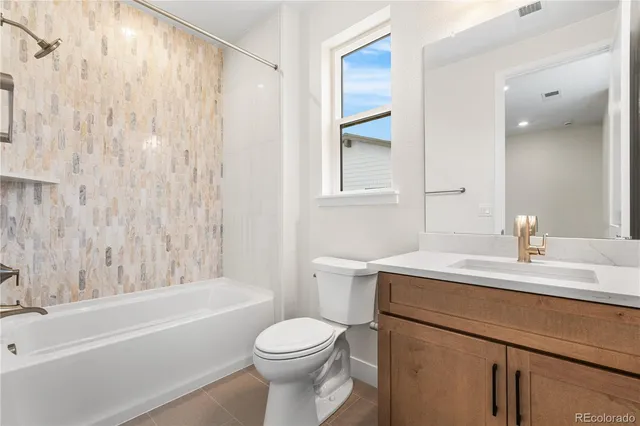 a bathroom with a sink a toilet and a bathtub