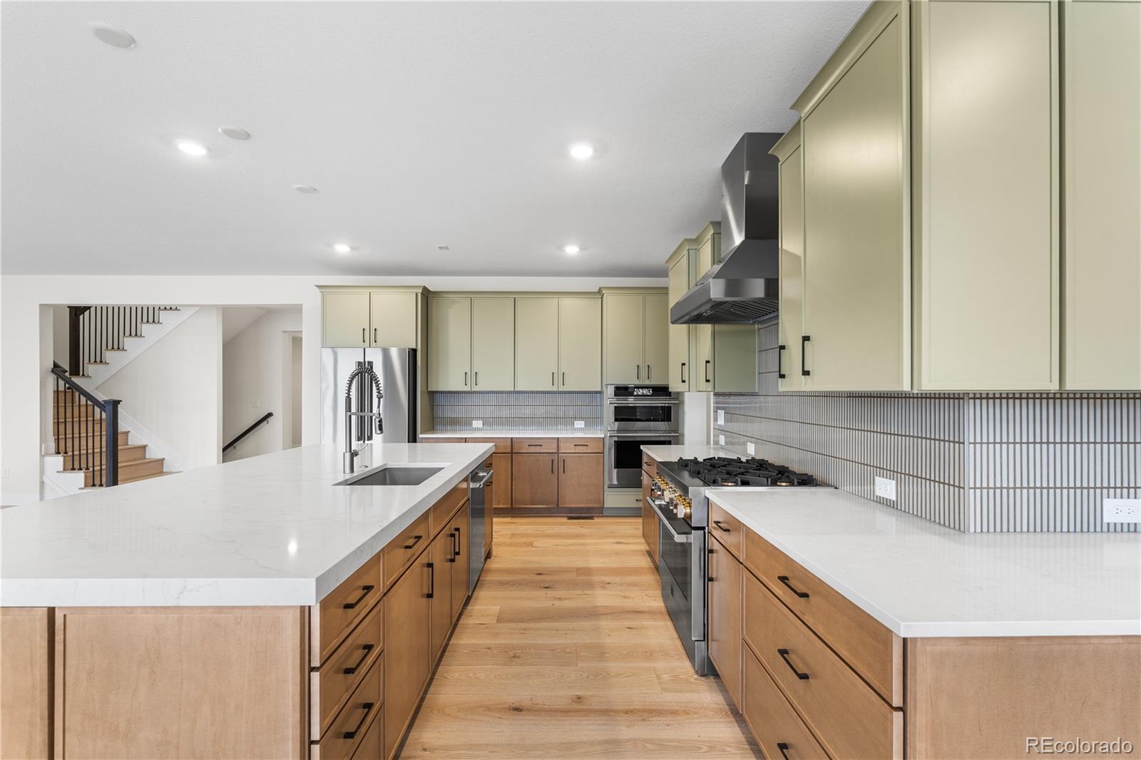 11303 Tenor Trail Lone Tree, CO 80134 - Photo 9 of 49 a kitchen with counter top space a sink and appliances