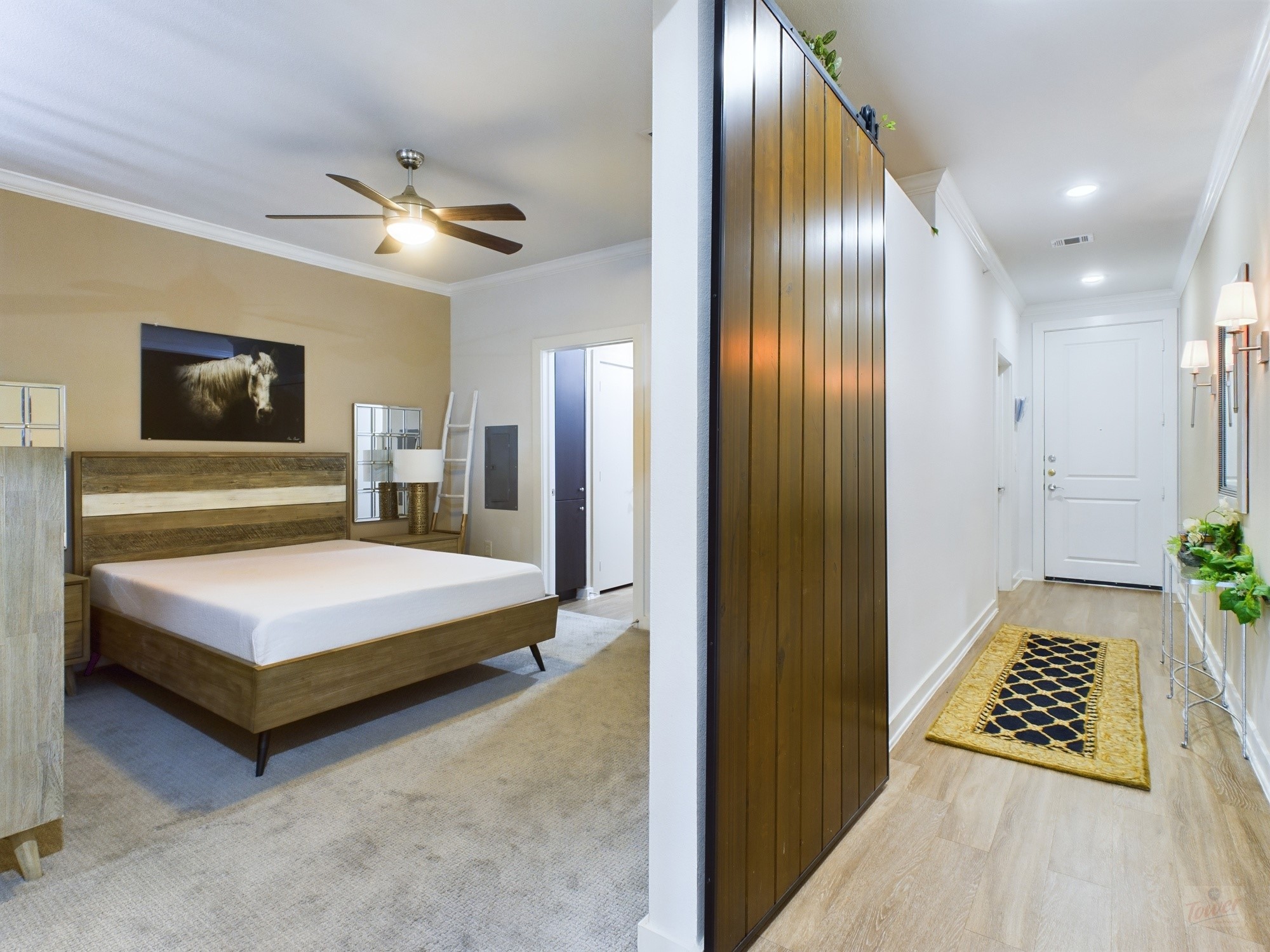 1900 Barton Springs Road, Unit 3040 Austin, TX 78704 - Photo 21 of 38 Bedroom featuring neutral wall colors, crown molding, and a ceiling fan with integrated lighting