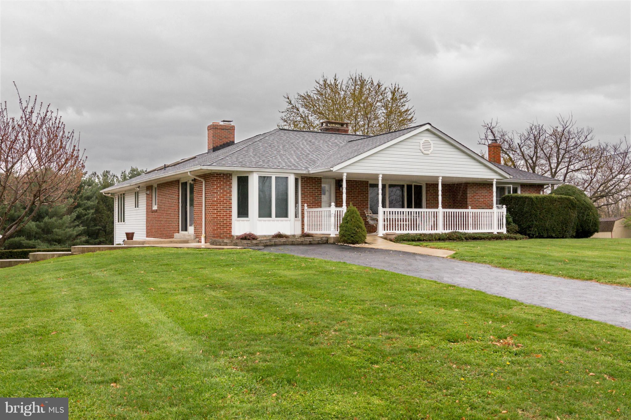 4201 Buffalo Road Mount Airy, MD 21771 - Photo 1 of 29 a front view of a house with a yard table and chairs