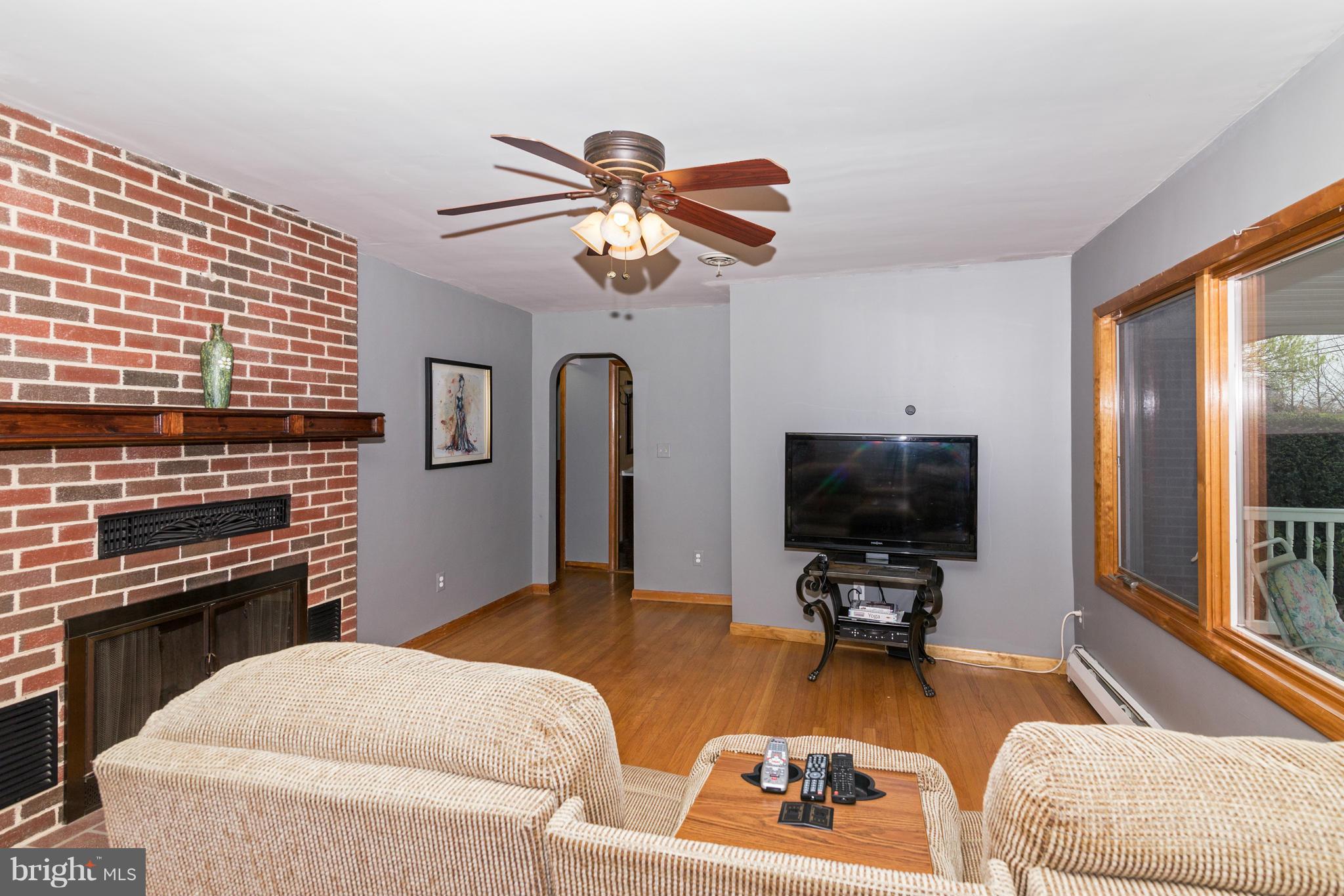 4201 Buffalo Road Mount Airy, MD 21771 - Photo 11 of 29 a living room with furniture and a flat screen tv