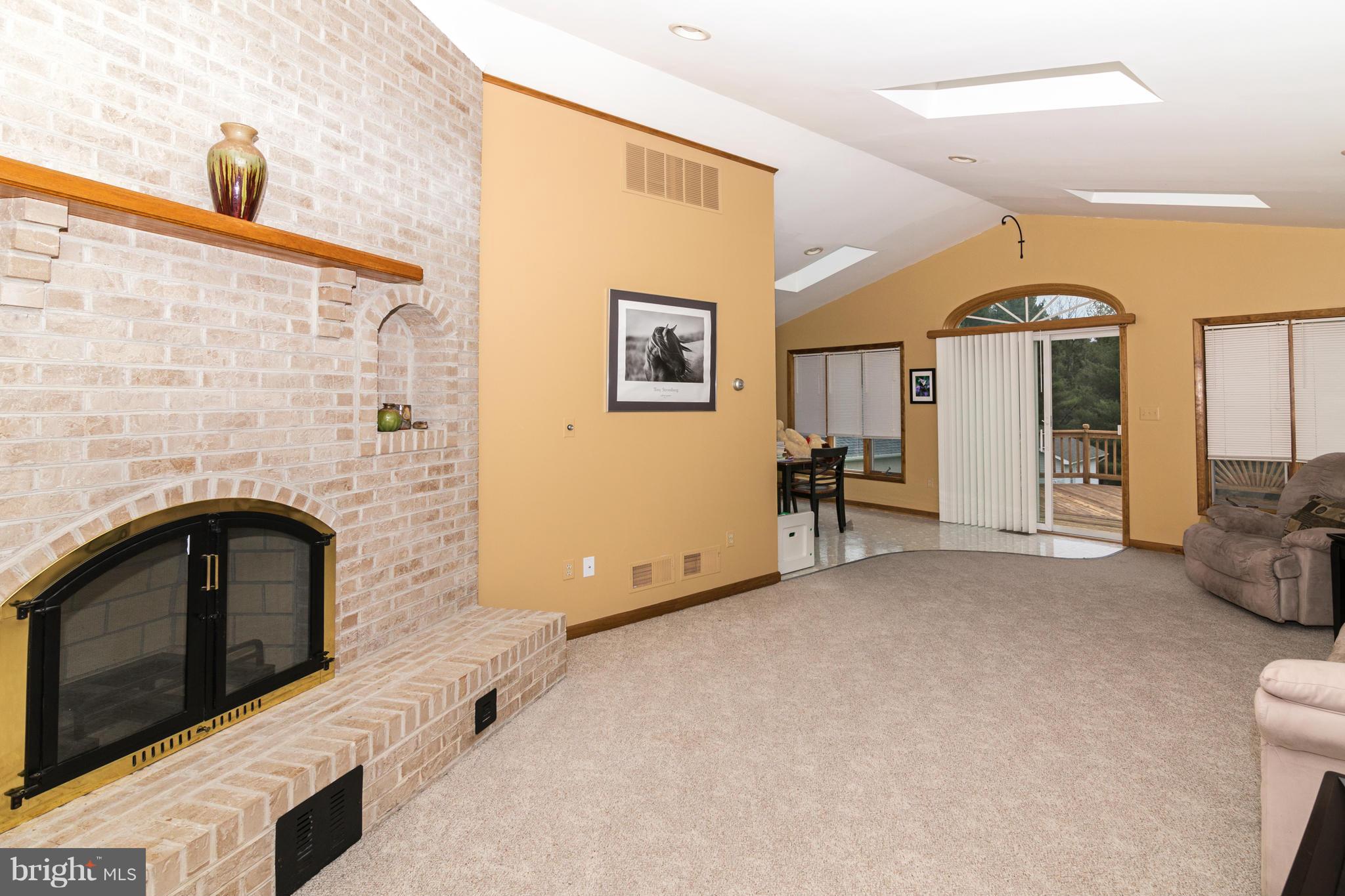 4201 Buffalo Road Mount Airy, MD 21771 - Photo 13 of 29 a view of an empty room with closet and a fireplace