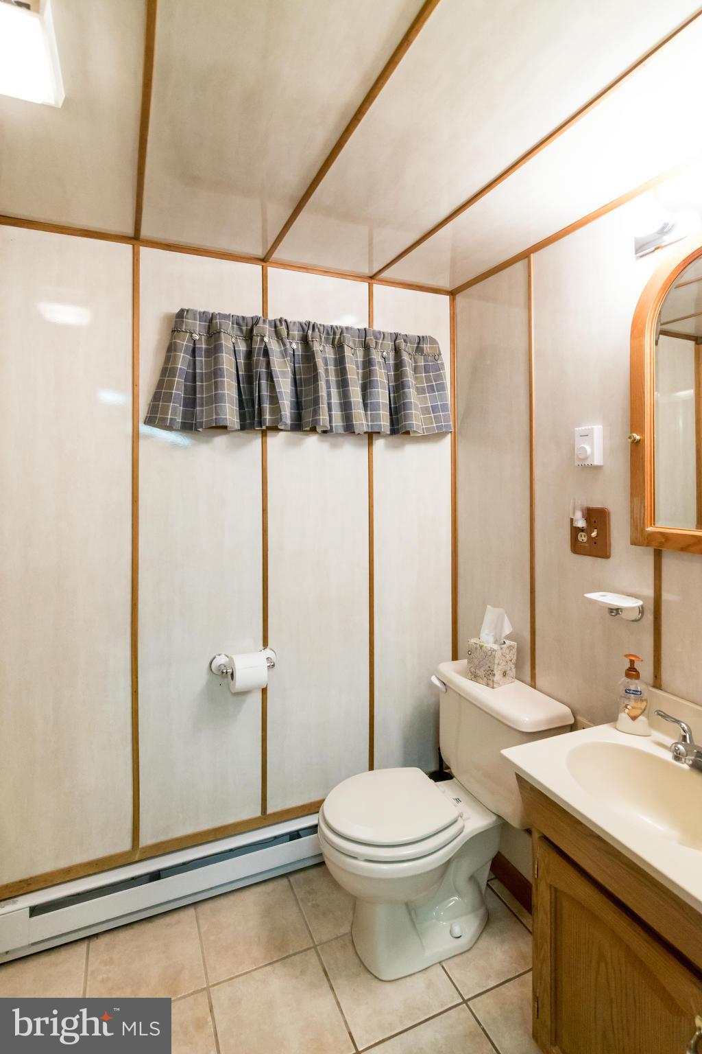 4201 Buffalo Road Mount Airy, MD 21771 - Photo 24 of 29 a bathroom with a toilet a sink and shower