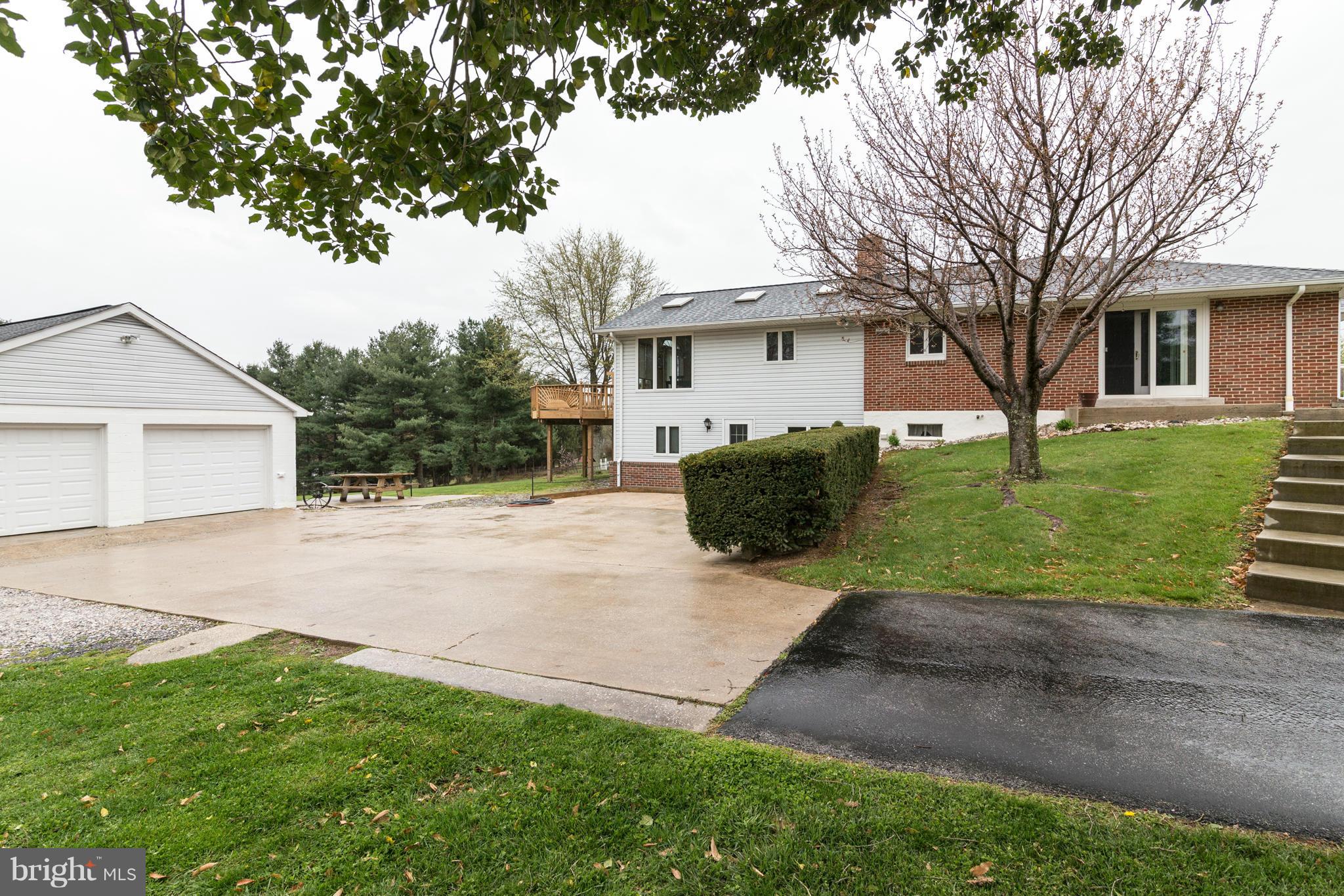 4201 Buffalo Road Mount Airy, MD 21771 - Photo 4 of 29 a view of a yard in front of a house with large tree