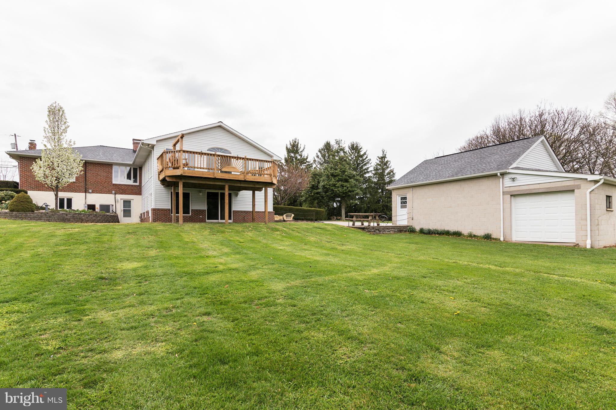 4201 Buffalo Road Mount Airy, MD 21771 - Photo 6 of 29 a front view of a house with a garden