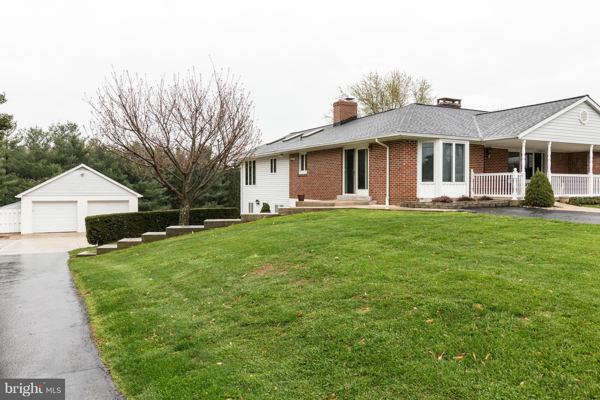 4201 Buffalo Road Mount Airy, MD 21771 - Photo 7 of 29 a front view of a house with a yard and trees