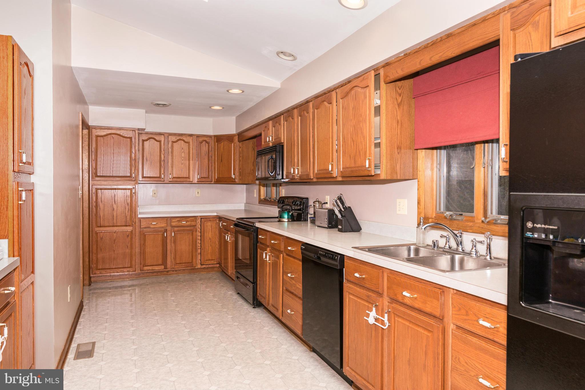 4201 Buffalo Road Mount Airy, MD 21771 - Photo 10 of 29 a kitchen with stainless steel appliances granite countertop a refrigerator sink and cabinets