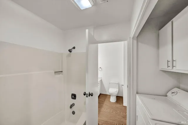 a bathroom with a bathtub and shower