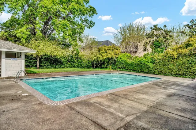 a view of a garden with a house