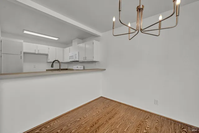 a kitchen with a sink cabinets and stainless steel appliances