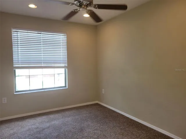 a view of a hallway with closet area