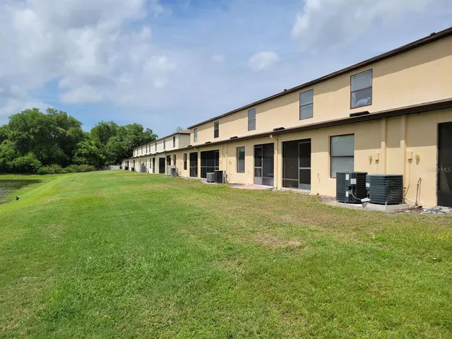 a view of a lake with houses in the back
