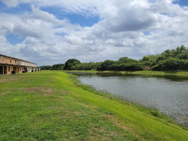 a view of a lake with a big yard