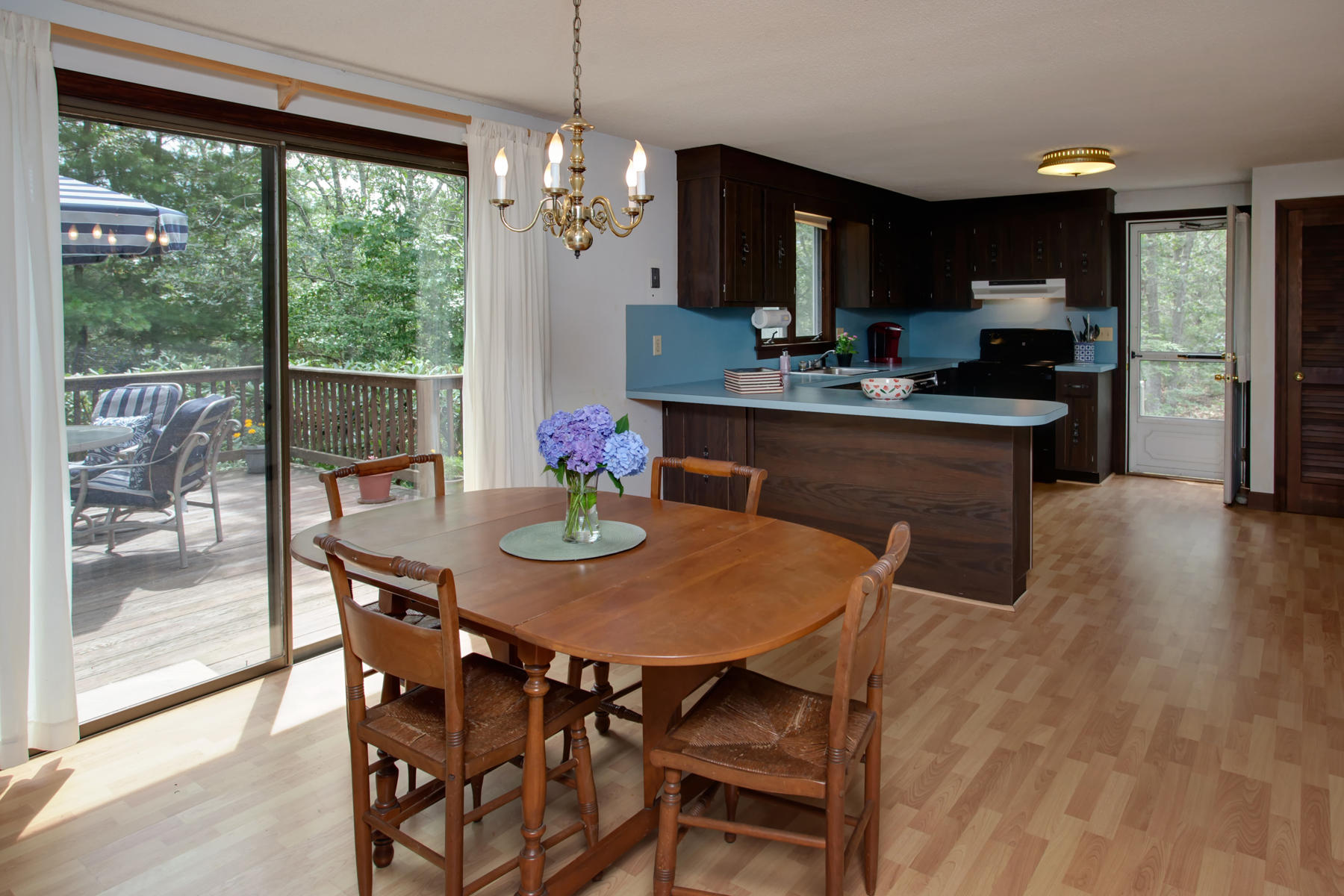 21 Oak Ridge Road East Sandwich, MA 02537 - Photo 12 of 31 a kitchen with stainless steel appliances granite countertop a kitchen island hardwood floor and a view of living room