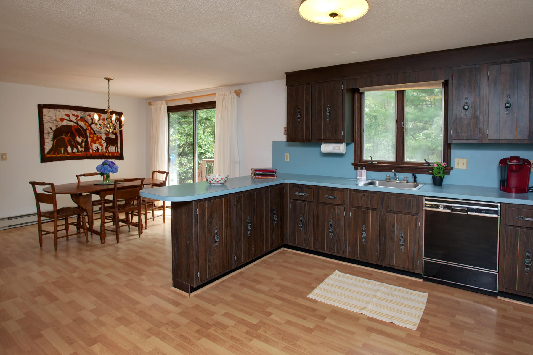 21 Oak Ridge Road East Sandwich, MA 02537 - Photo 16 of 31 a kitchen with stainless steel appliances granite countertop a stove a sink dishwasher and a microwave oven with cabinets