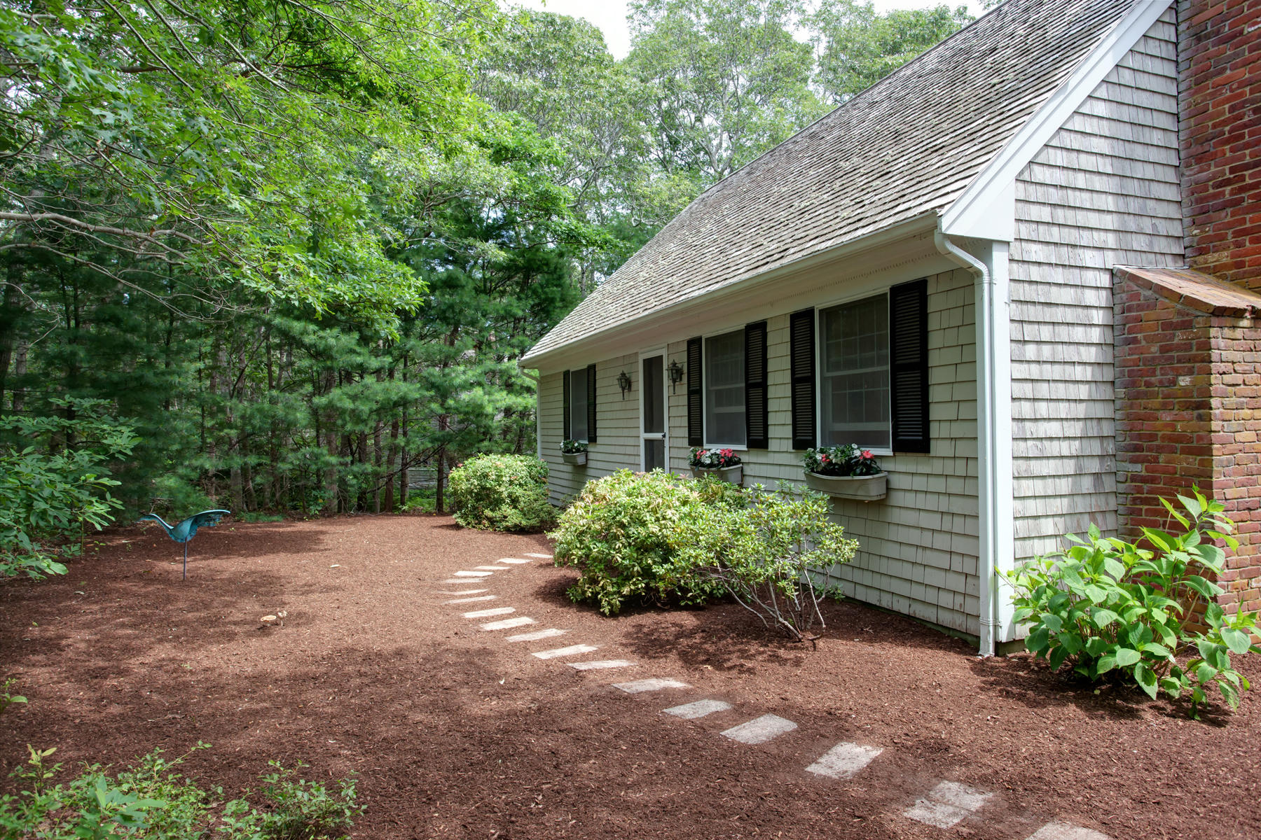 21 Oak Ridge Road East Sandwich, MA 02537 - Photo 2 of 31 a view of a house with a yard and plants