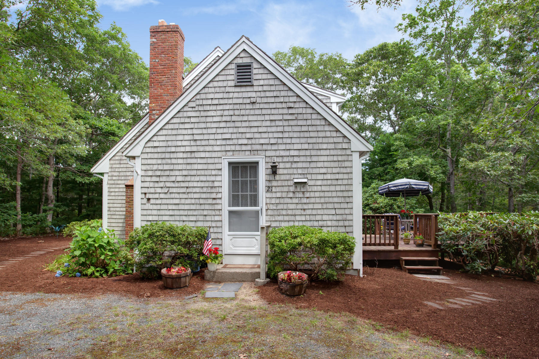 21 Oak Ridge Road East Sandwich, MA 02537 - Photo 23 of 31 a view of a house with a yard and sitting area