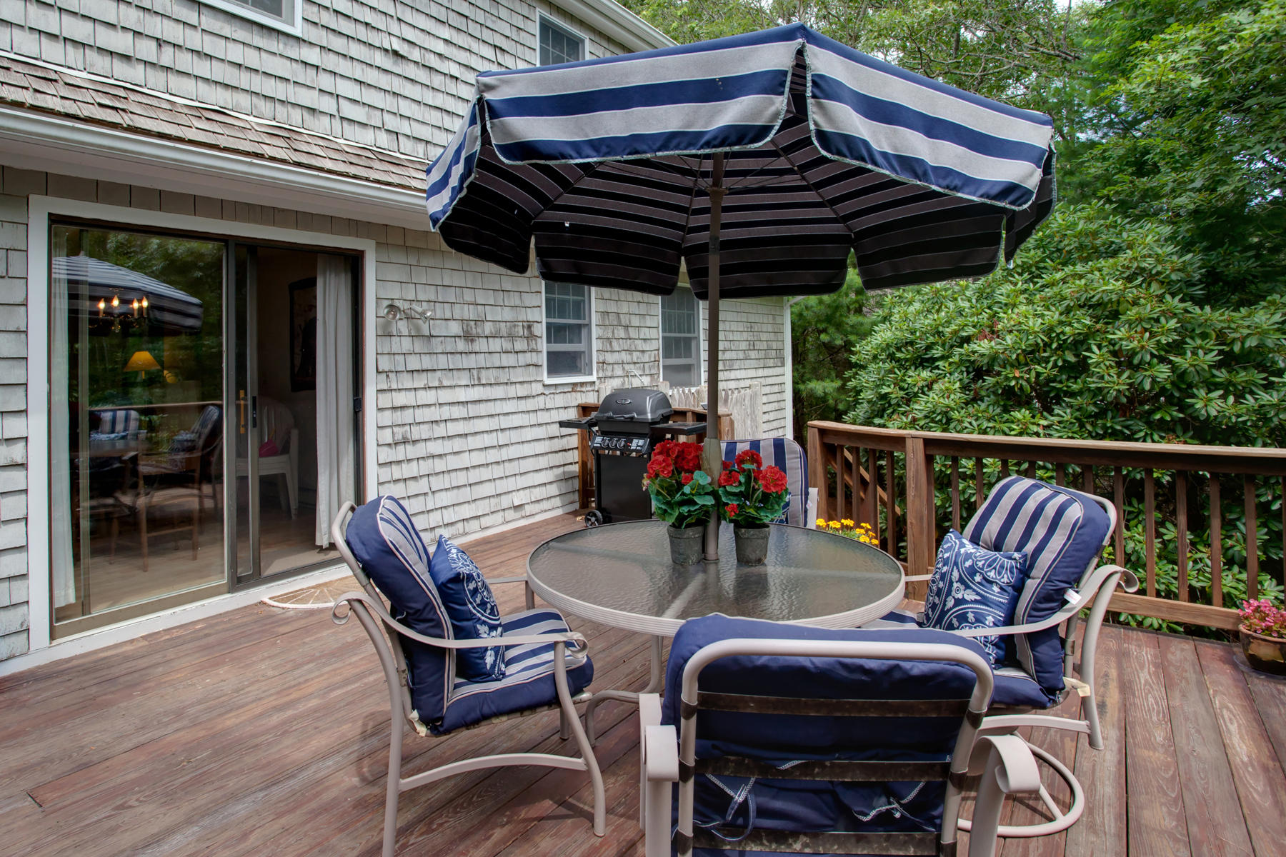21 Oak Ridge Road East Sandwich, MA 02537 - Photo 27 of 31 a view of a chairs and table in the patio