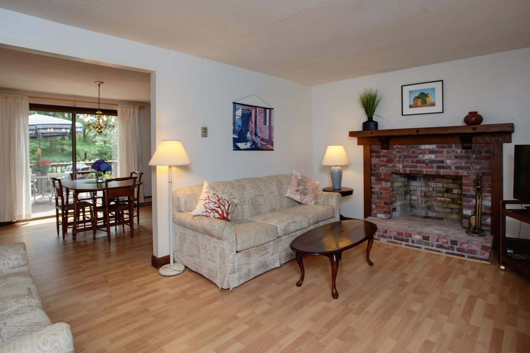21 Oak Ridge Road East Sandwich, MA 02537 - Photo 10 of 31 a living room with furniture and a fireplace