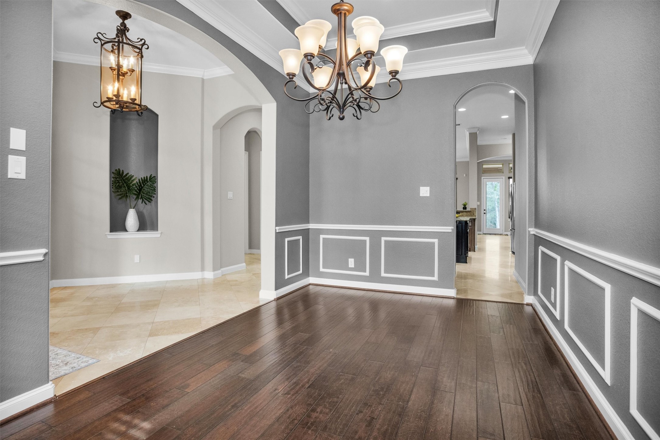 27910 Hansons Court Spring, TX 77386 - Photo 5 of 50 Formal dining with tray ceiling and decorative wainscot trim