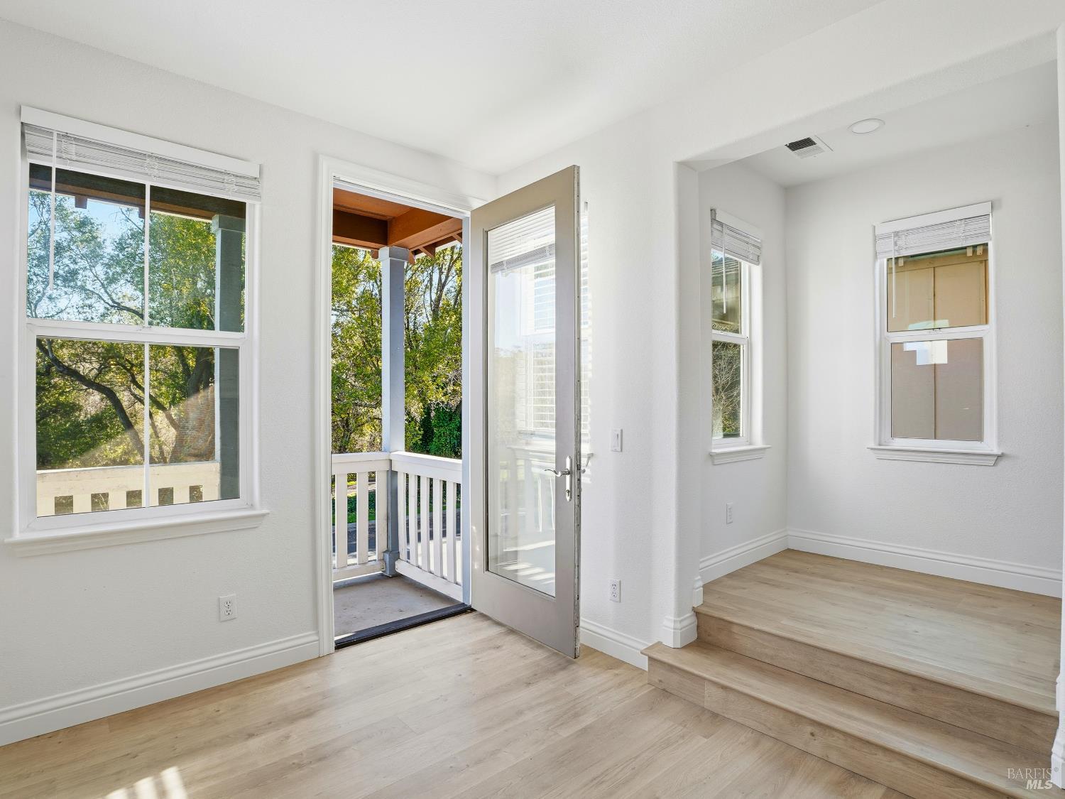 4424 Streamside Drive Santa Rosa, CA 95409 - Photo 8 of 55 a view of a room with wooden floor and windows