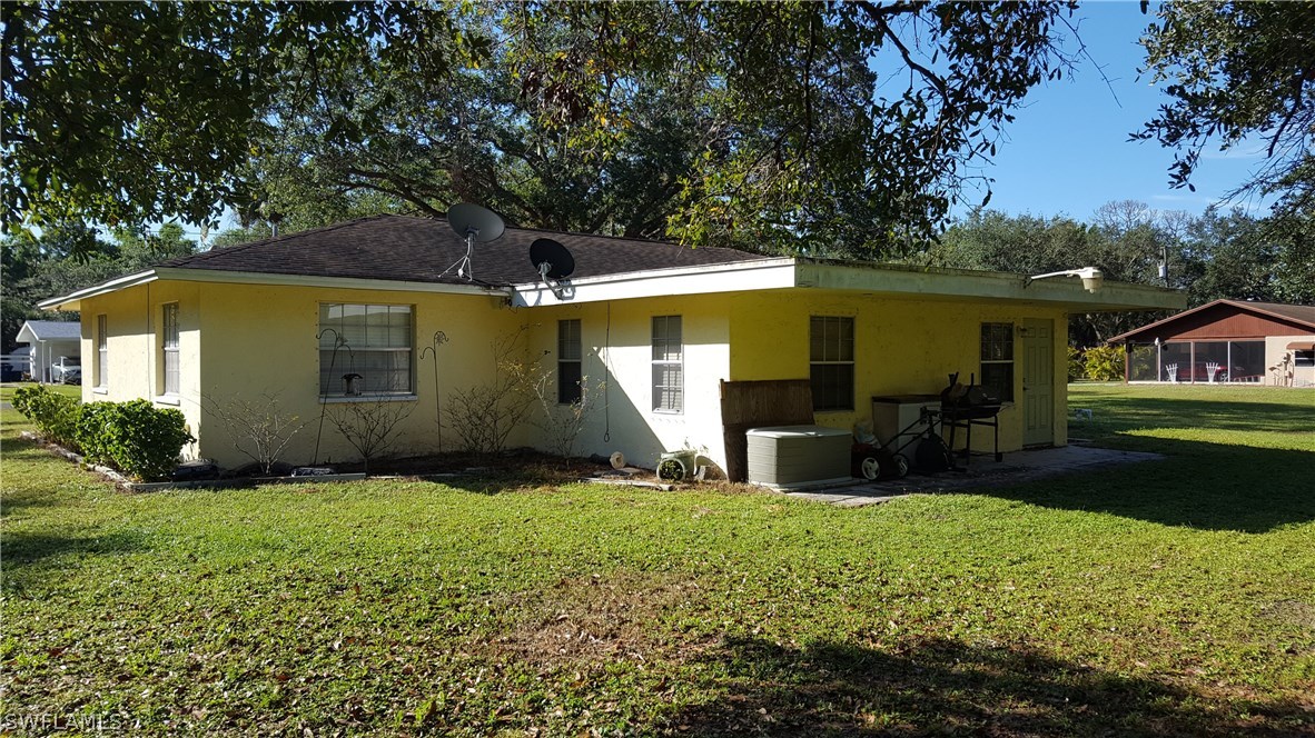 4030 Ellis Road Fort Myers, FL 33905 - Photo 3 of 22 a view of a house with backyard and sitting area