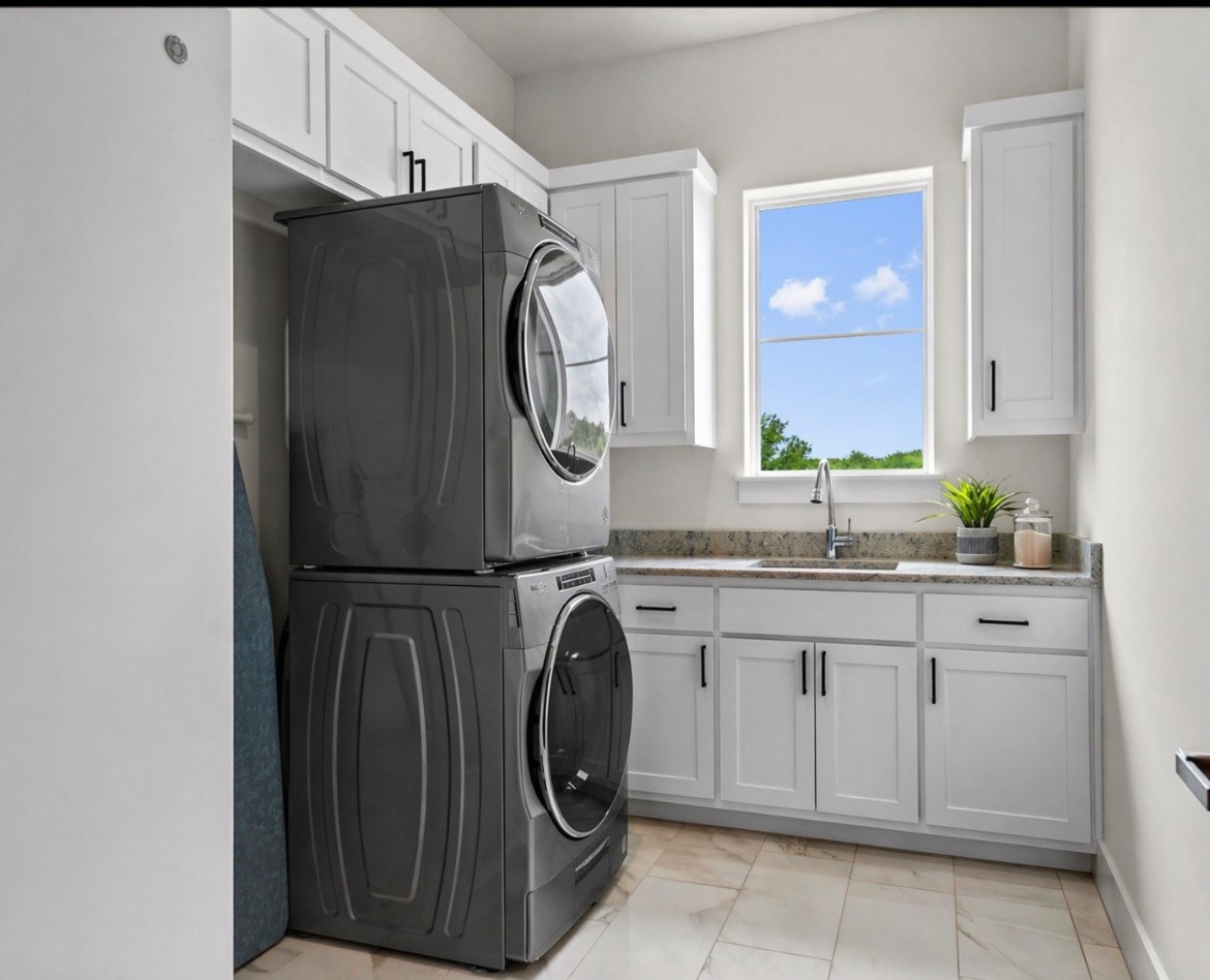 1805 Performer Road Spicewood, TX 78669 - Photo 11 of 40 Laundry room with extra storage and a added sink as a bonus!
