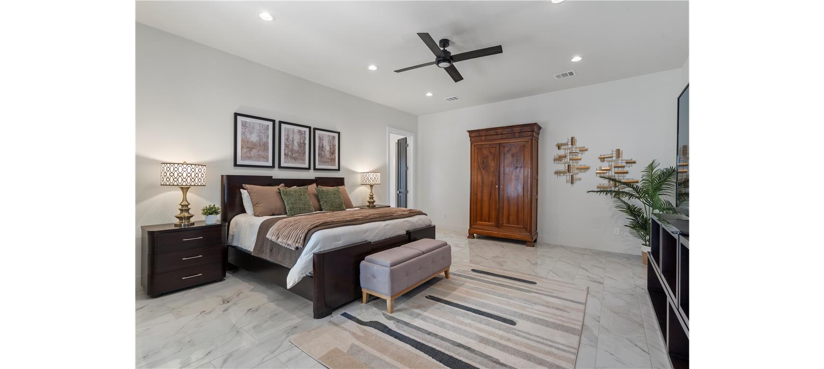 1805 Performer Road Spicewood, TX 78669 - Photo 12 of 40 Spacious primary suite tucked to the side of the home, giving you privacy and relaxation.