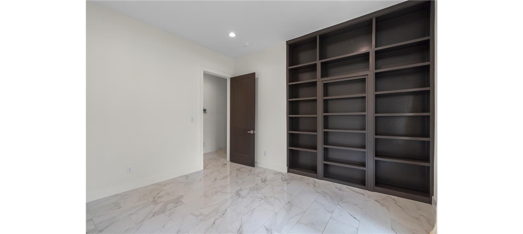 1805 Performer Road Spicewood, TX 78669 - Photo 17 of 40 Spacious office featuring a full wall of built-in shelving