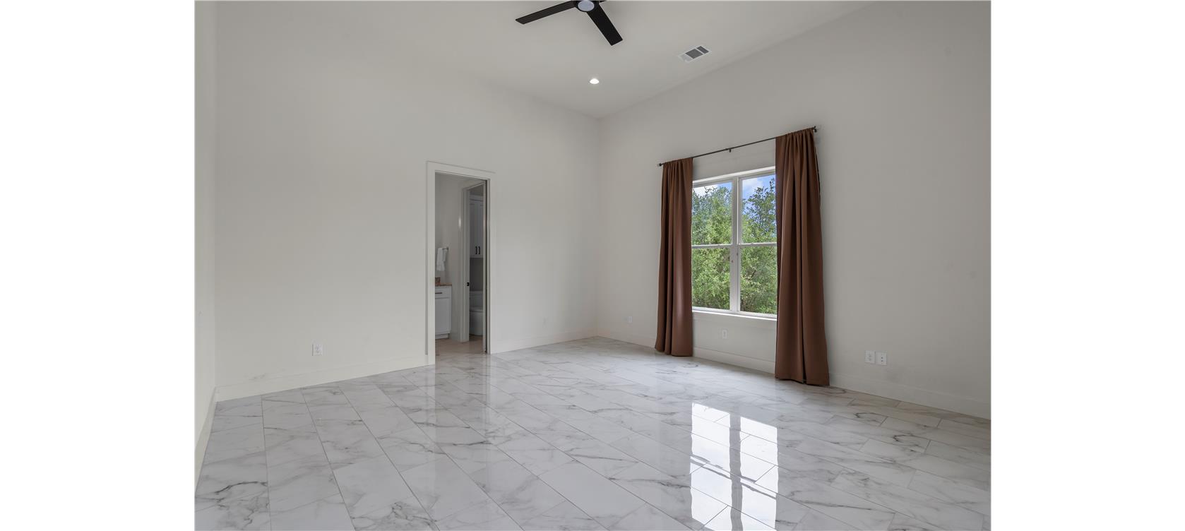 1805 Performer Road Spicewood, TX 78669 - Photo 20 of 40 Secondary bedroom with full bathroom attached