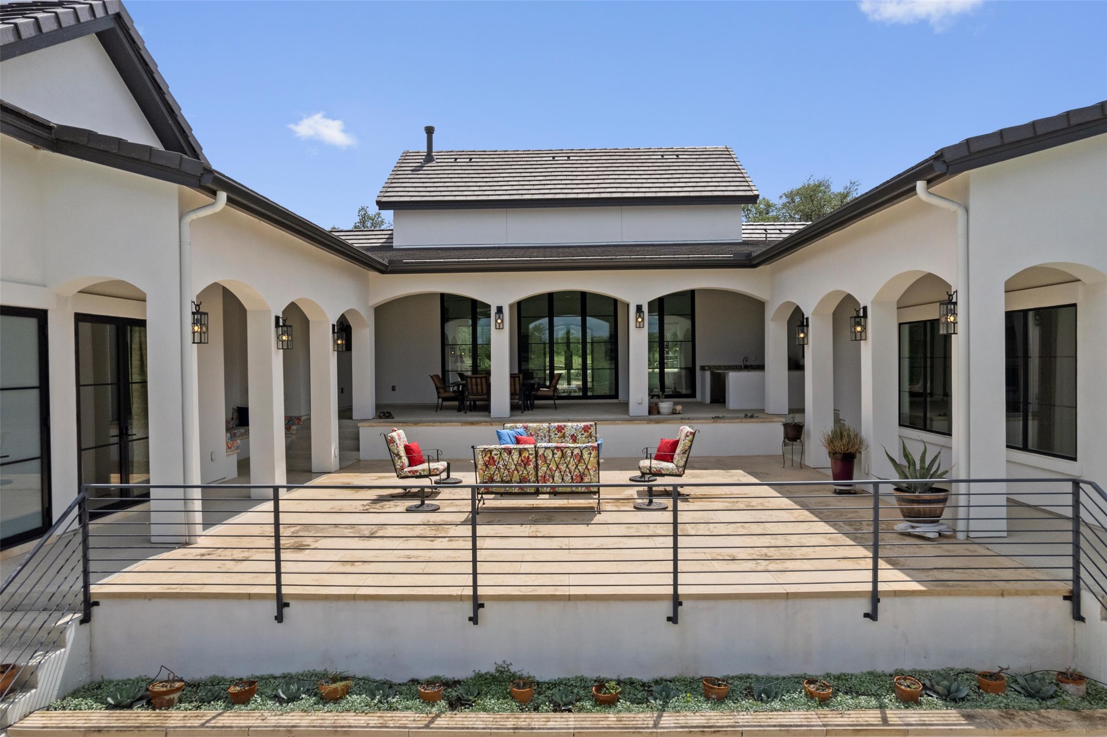 1805 Performer Road Spicewood, TX 78669 - Photo 23 of 40 horse shoe shape giving bedrooms access the the outdoor areas.