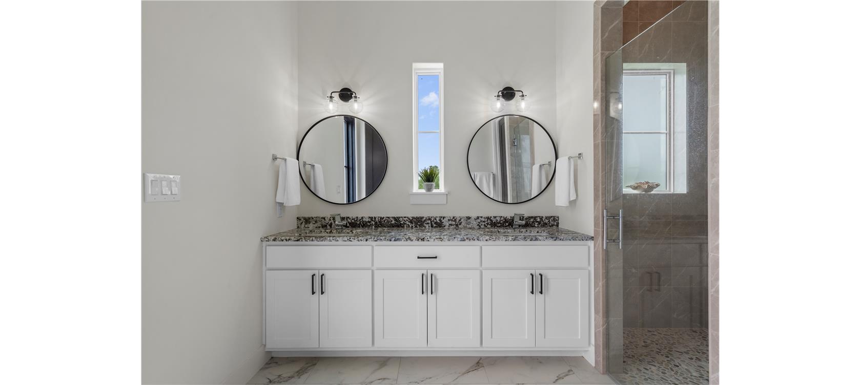 1805 Performer Road Spicewood, TX 78669 - Photo 27 of 40 Dual vanity in this full bathroom in the guesthouse