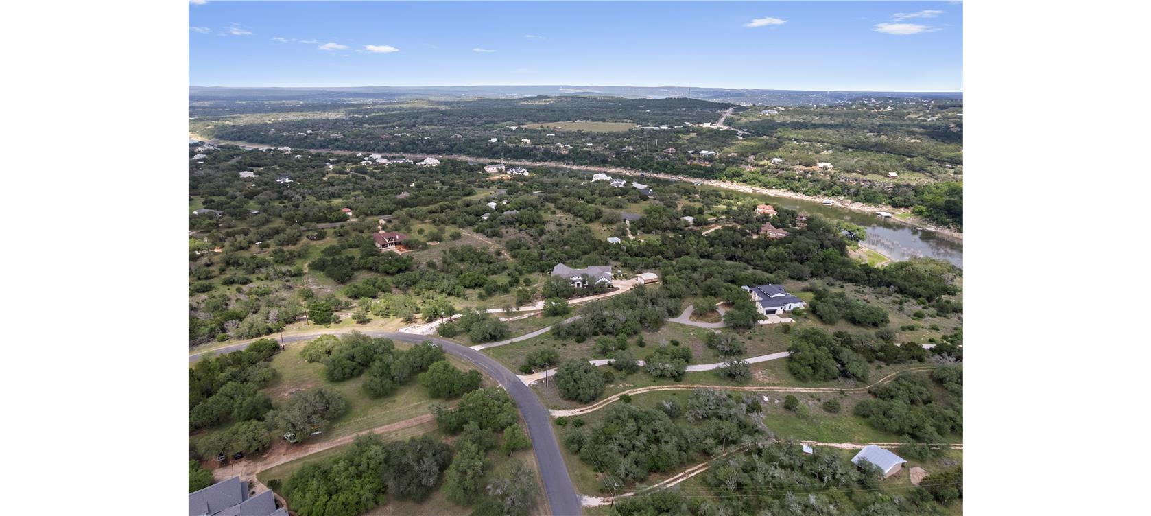 1805 Performer Road Spicewood, TX 78669 - Photo 37 of 40 Expansive aerial showcasing the 7.51-acres on a cul-de-sac street overlooking the Pedernales. Property line extends into the Pedernales River-right on a cove with the possibility to add a boathouse/dock on the property.