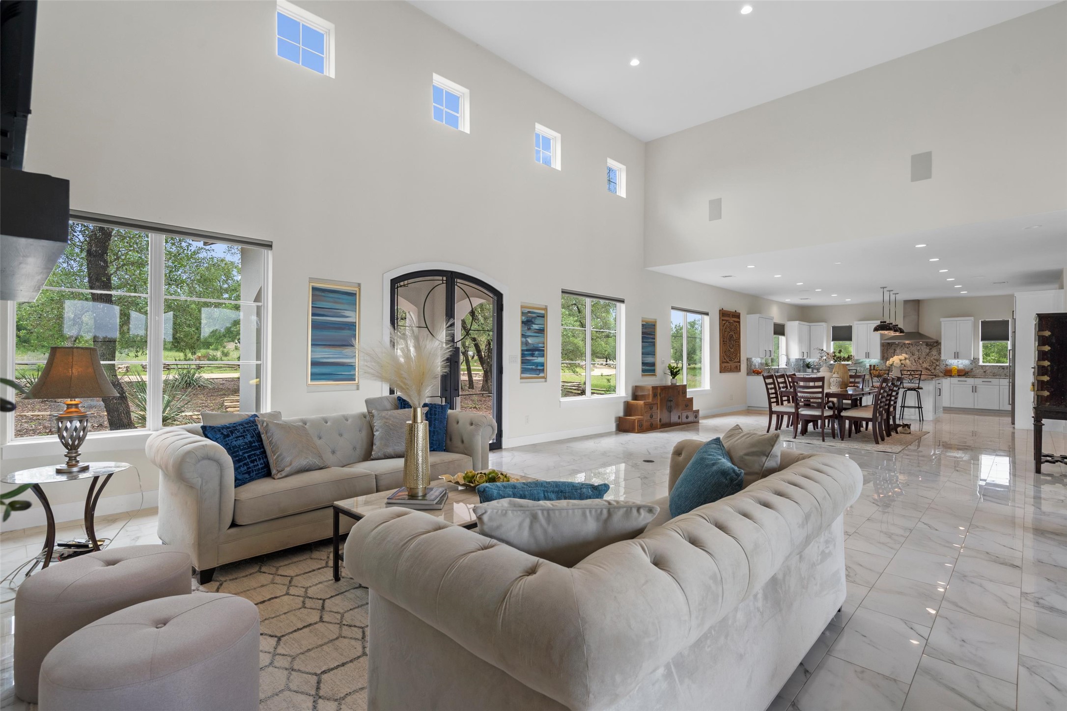 1805 Performer Road Spicewood, TX 78669 - Photo 6 of 40 open-concept layout seamlessly connects the living, dining, and kitchen-ideal for everyday living and entertaining.