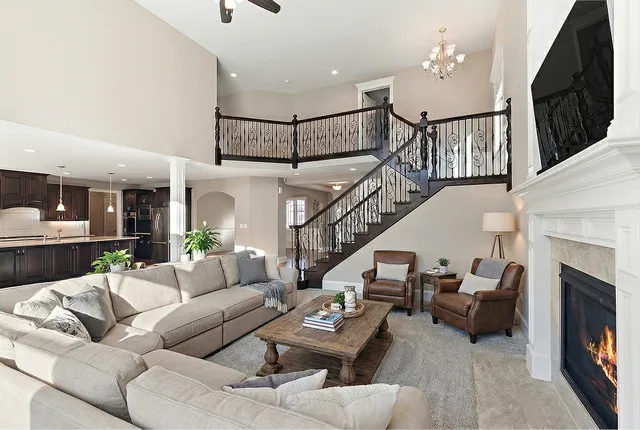 a bedroom with a bed and a couch with window