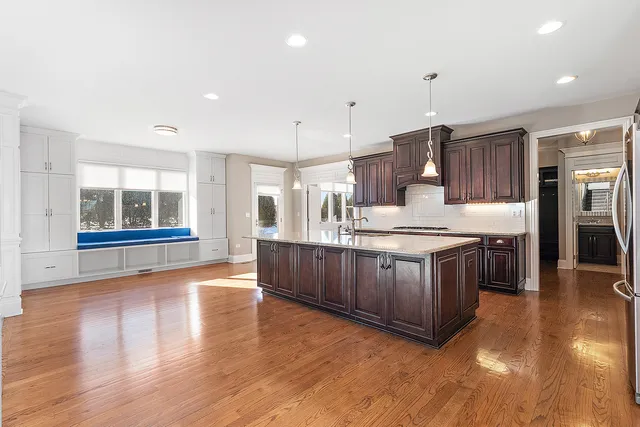 a view of a livingroom with a ceiling fan and window