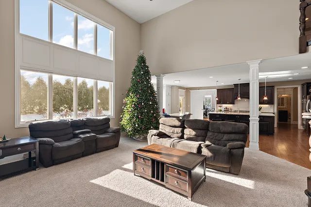a large kitchen with a table and chairs