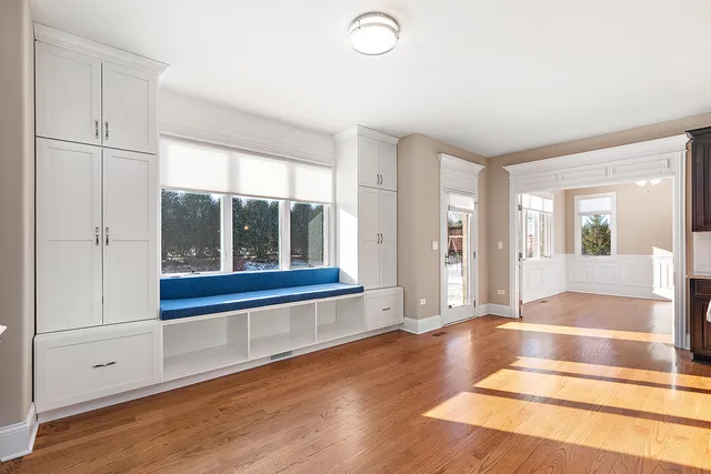 a bathroom with a granite countertop double vanity sink and mirror with bathtub