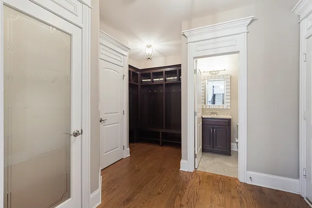 a bathroom with a toilet a bath tub a sink and mirror