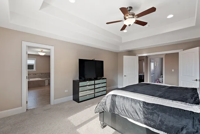 a view of walk in closet with clothes